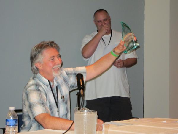 Mark McKenna receiving the Joe Sinnott Hall of Fame Award in 2012 (with Presenter Marc Deering)